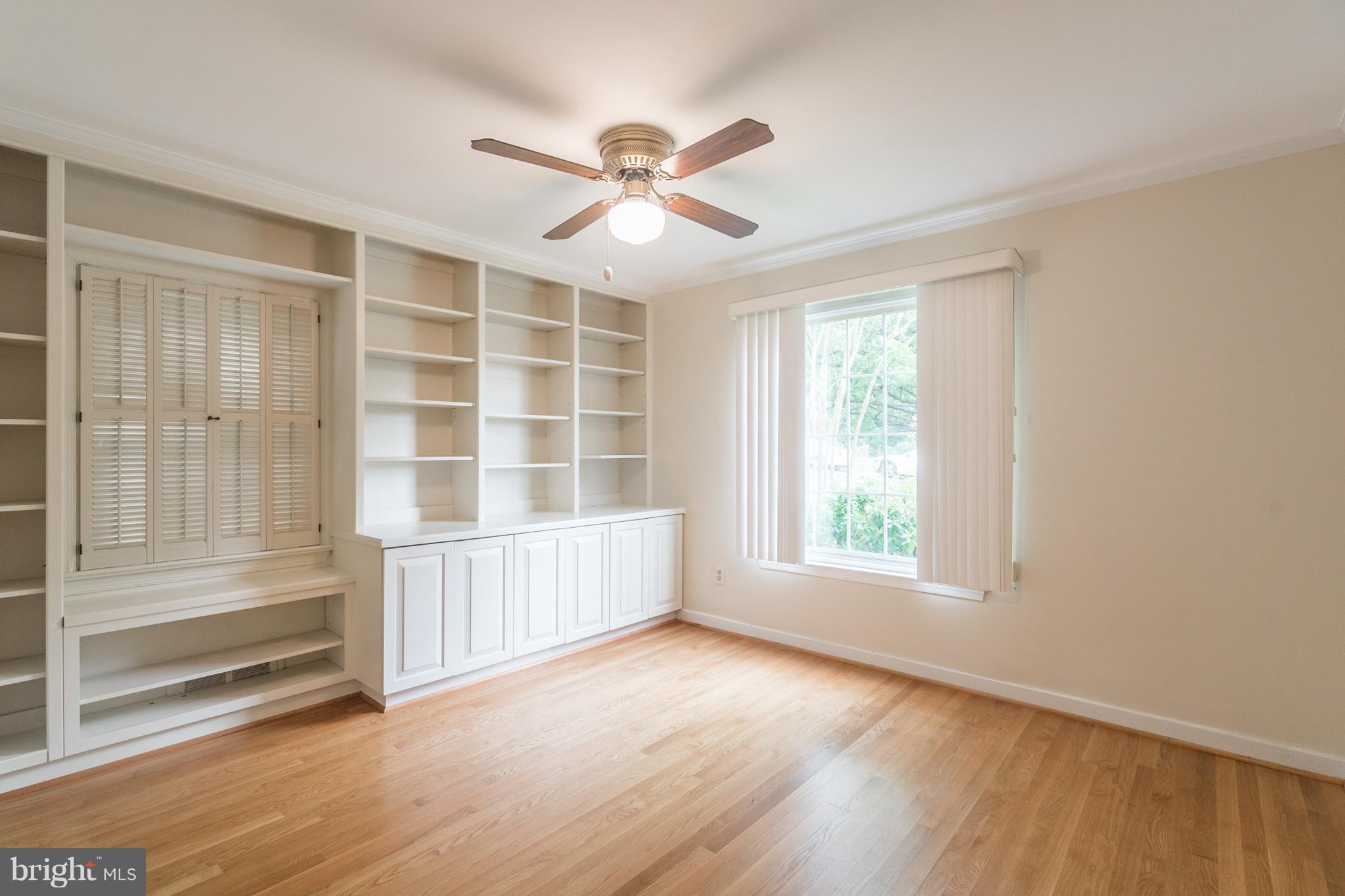 6104 28th Street North Arlington, VA 22207 - Photo 17 of 30 a view of an empty room with a window and wooden floor