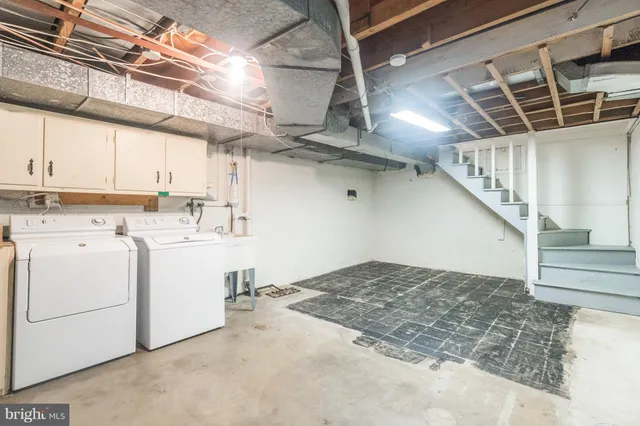 a view of a hallway with washer and dryer
