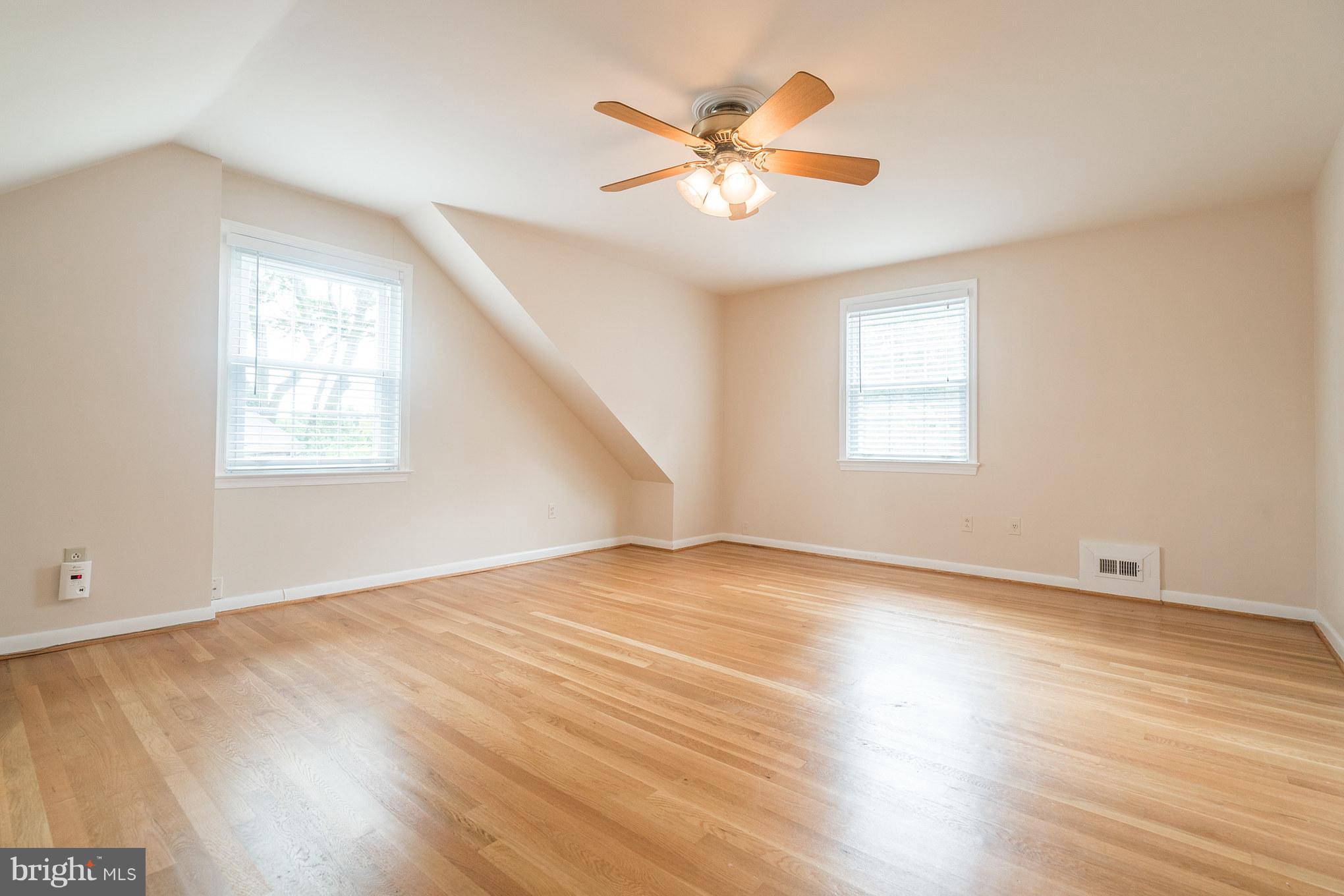 6104 28th Street North Arlington, VA 22207 - Photo 21 of 30 a view of an empty room with wooden floor and a window