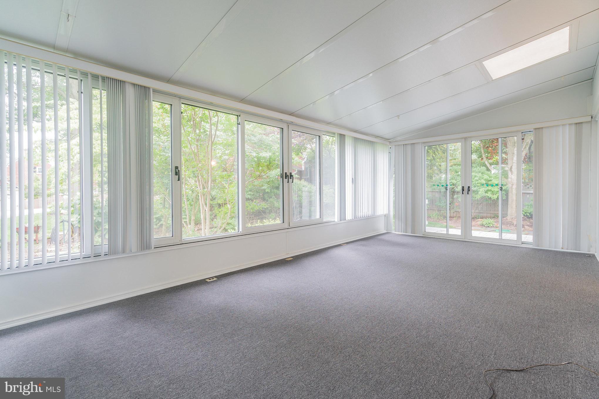 6104 28th Street North Arlington, VA 22207 - Photo 27 of 30 a view of a big room with windows and chandelier fan