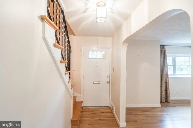 a view of an entryway with wooden floor