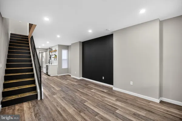 a view of wooden floor and stairs in a room