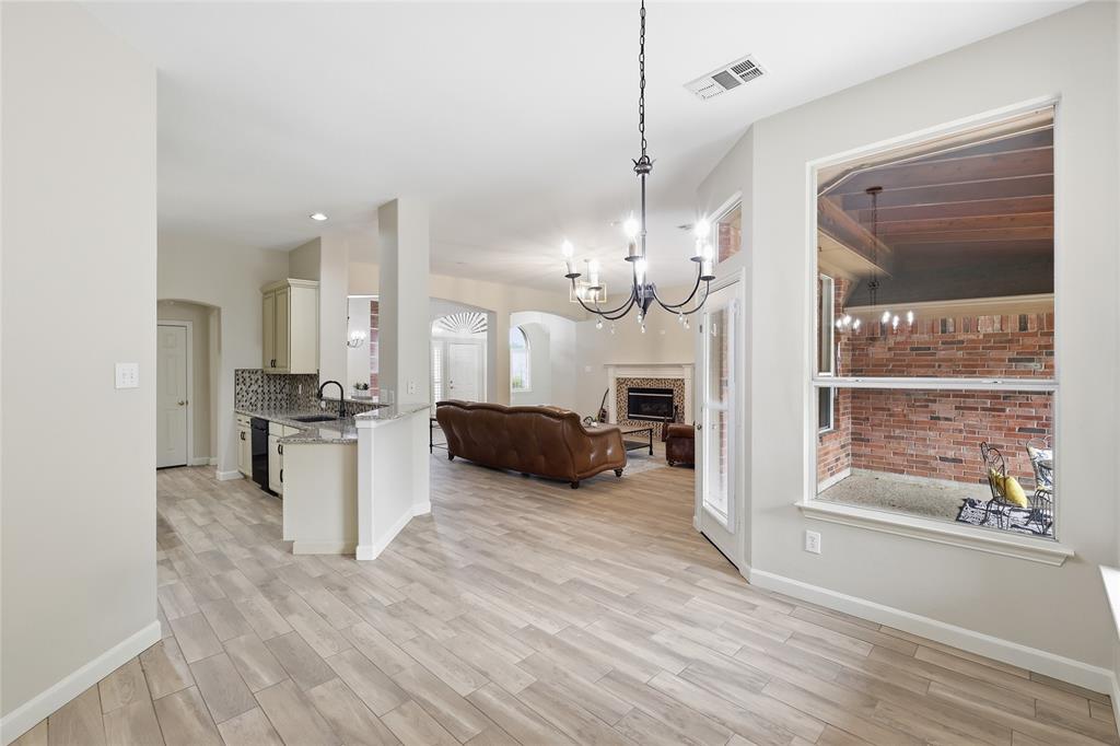 2402 Ravinia Drive Corinth, TX 76208 - Photo 21 of 40 Breakfast area is positioned next to the kitchen with easy access to the living room