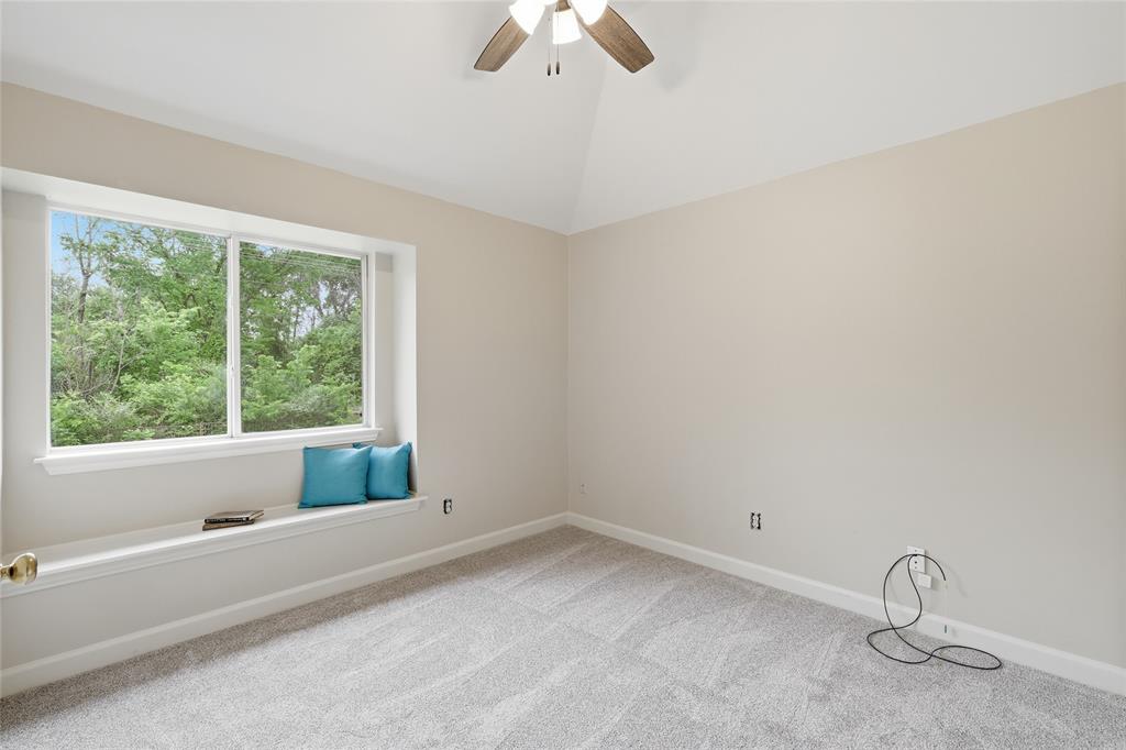 2402 Ravinia Drive Corinth, TX 76208 - Photo 33 of 40 Extended covered patio featuring an exposed wood beam ceiling with a view of the pool area and large back yard