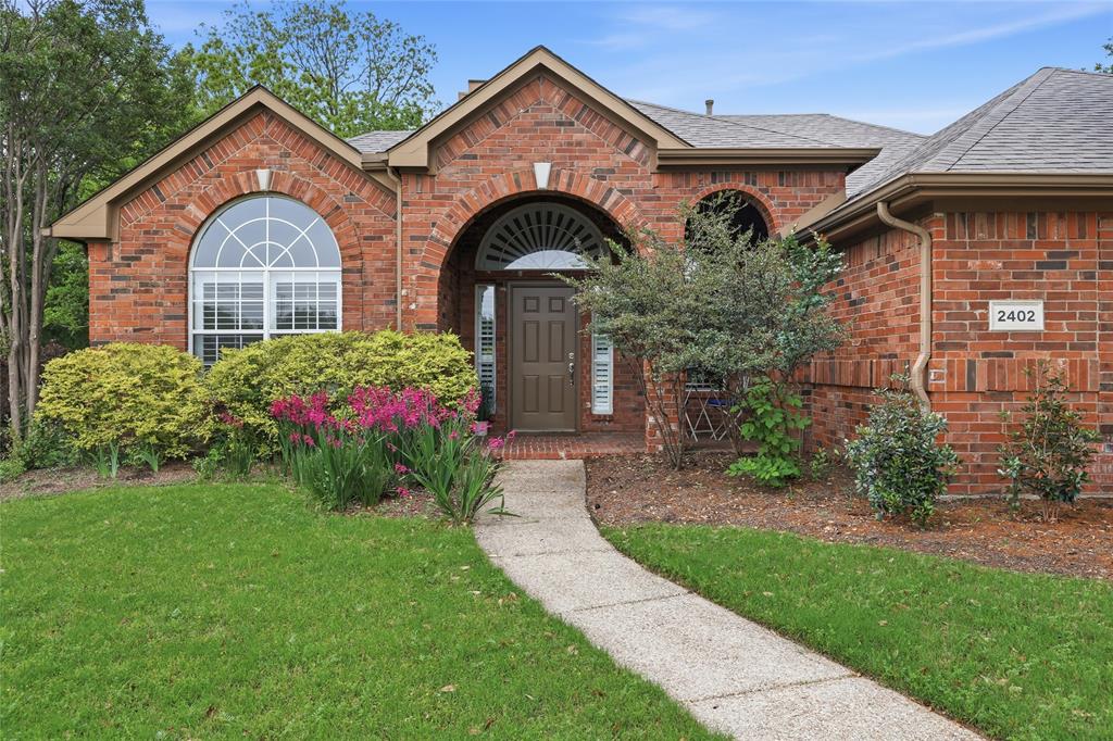 2402 Ravinia Drive Corinth, TX 76208 - Photo 6 of 40 Beautiful established landscaping in the front of this well maintained home.