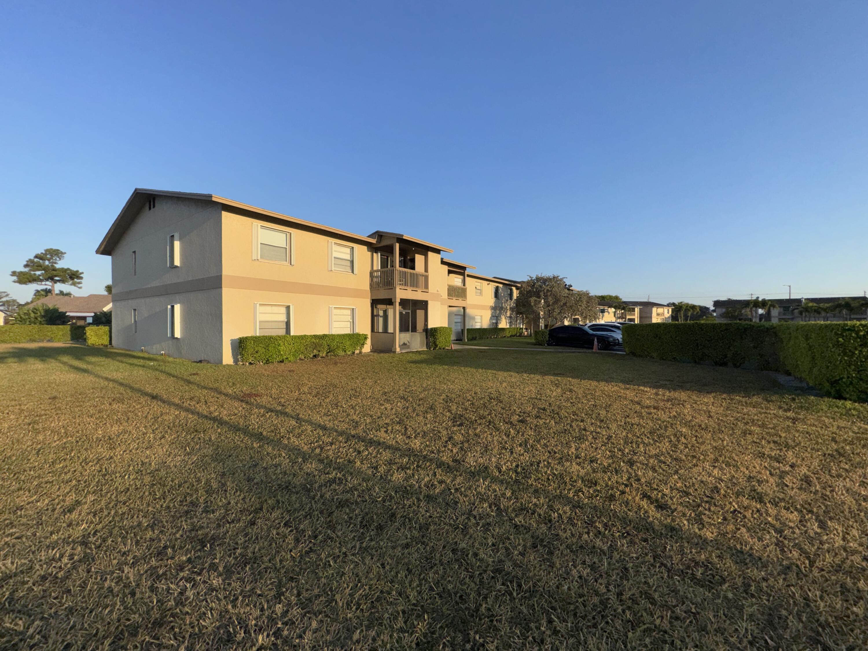 1798 Abbey Road, Unit 207 West Palm Beach, FL 33415 - Photo 20 of 25 Exterior Front