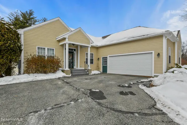 a front view of house with garage