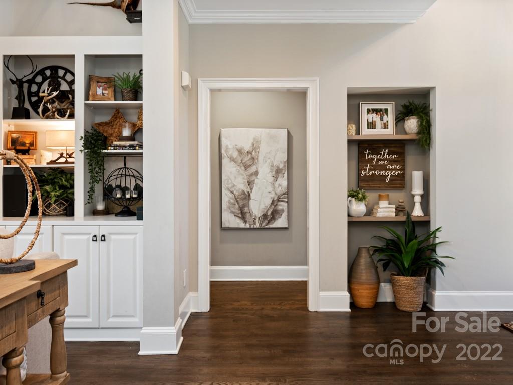 5015 Rea Road Charlotte, NC 28226 - Photo 13 of 48 a view of a hallway with wooden floor and windows