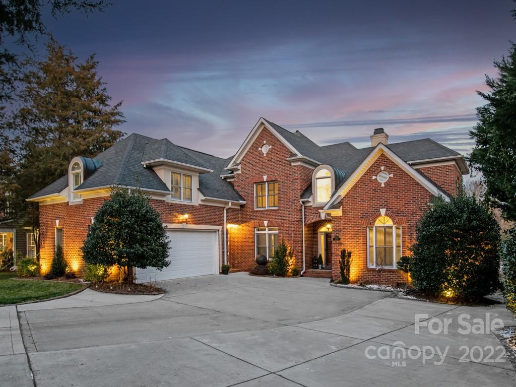5015 Rea Road Charlotte, NC 28226 - Photo 2 of 48 a front view of a house with a yard and garage