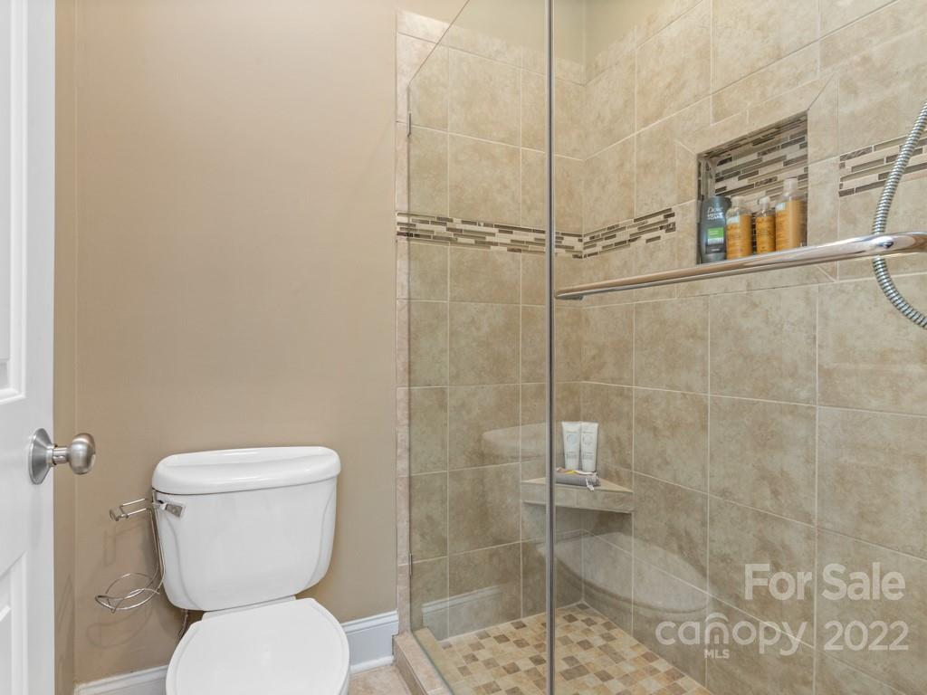 5015 Rea Road Charlotte, NC 28226 - Photo 25 of 48 a bathroom with a toilet and a shower