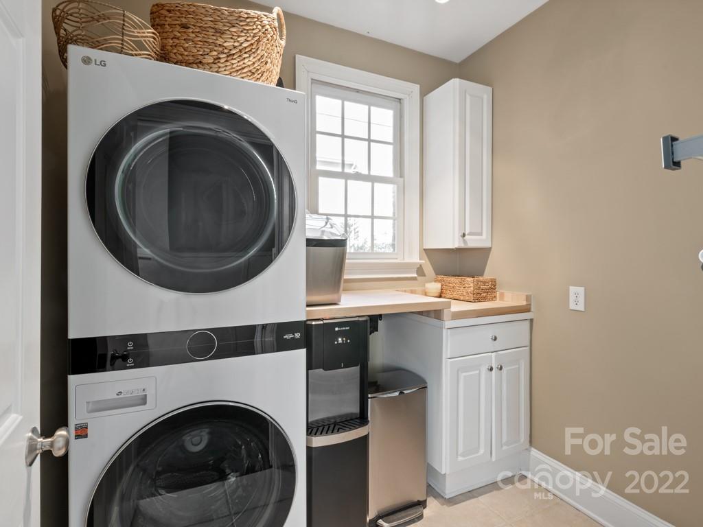 5015 Rea Road Charlotte, NC 28226 - Photo 29 of 48 a utility room with dryer washer and a window