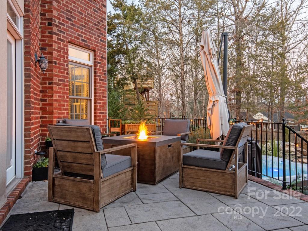 5015 Rea Road Charlotte, NC 28226 - Photo 30 of 48 a view of a patio with a table and chairs