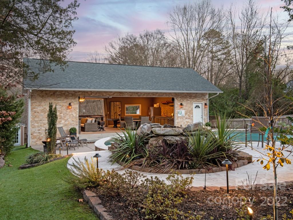 5015 Rea Road Charlotte, NC 28226 - Photo 35 of 48 a view of a house with backyard sitting area and garden