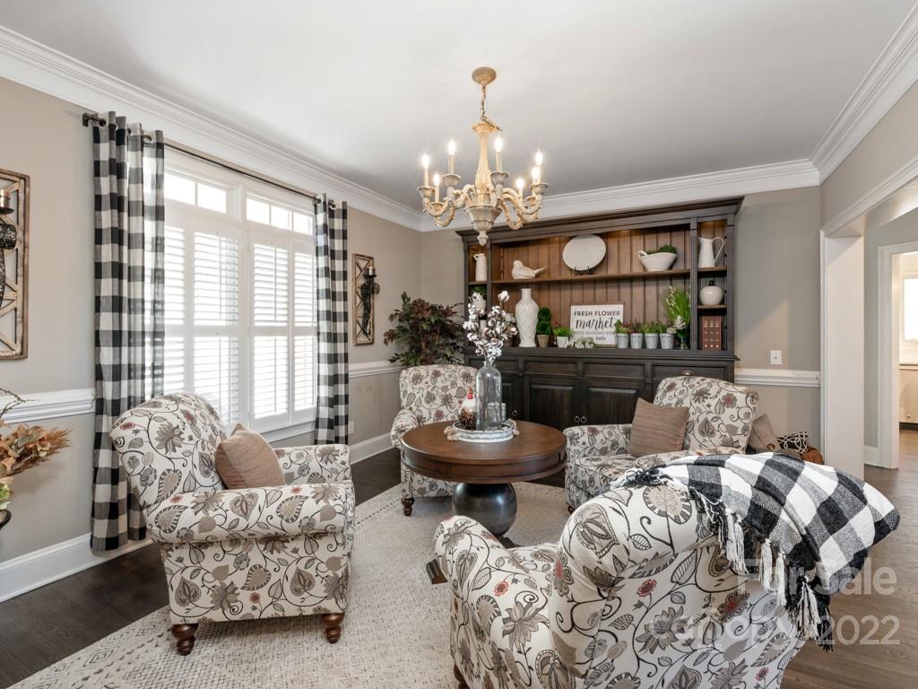 5015 Rea Road Charlotte, NC 28226 - Photo 5 of 48 a living room with furniture and a chandelier
