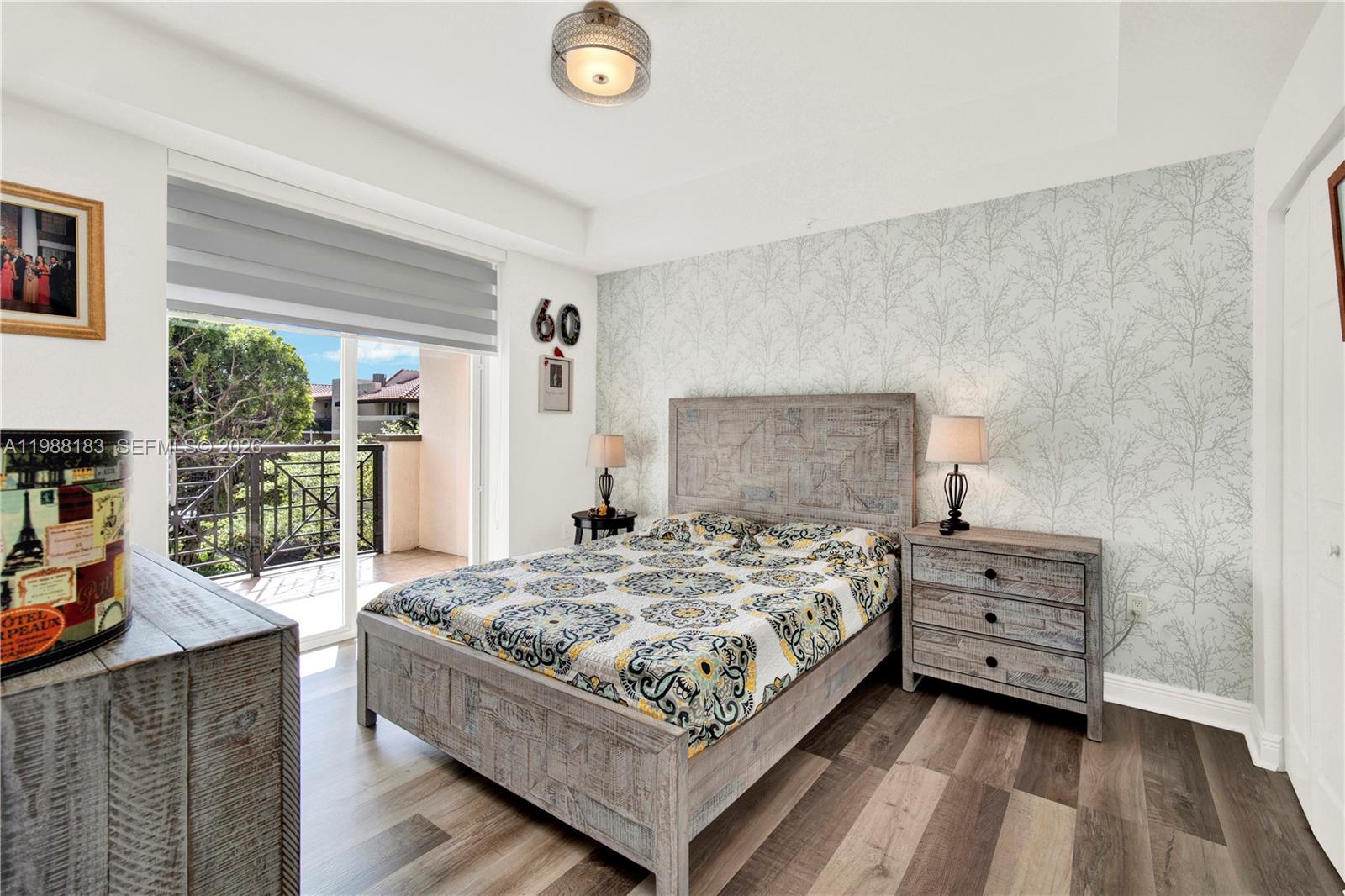 9021 Southwest 94th Street, Unit 308 Miami, FL 33176 - Photo 11 of 35 a bedroom with a bed and large windows