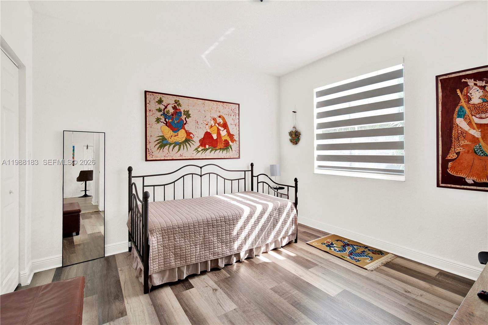 9021 Southwest 94th Street, Unit 308 Miami, FL 33176 - Photo 21 of 35 a bedroom with a bed and a window