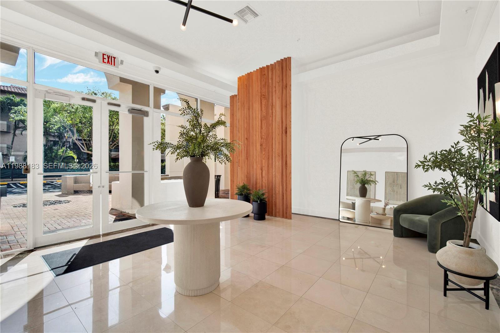 9021 Southwest 94th Street, Unit 308 Miami, FL 33176 - Photo 25 of 35 a living room with furniture and potted plants