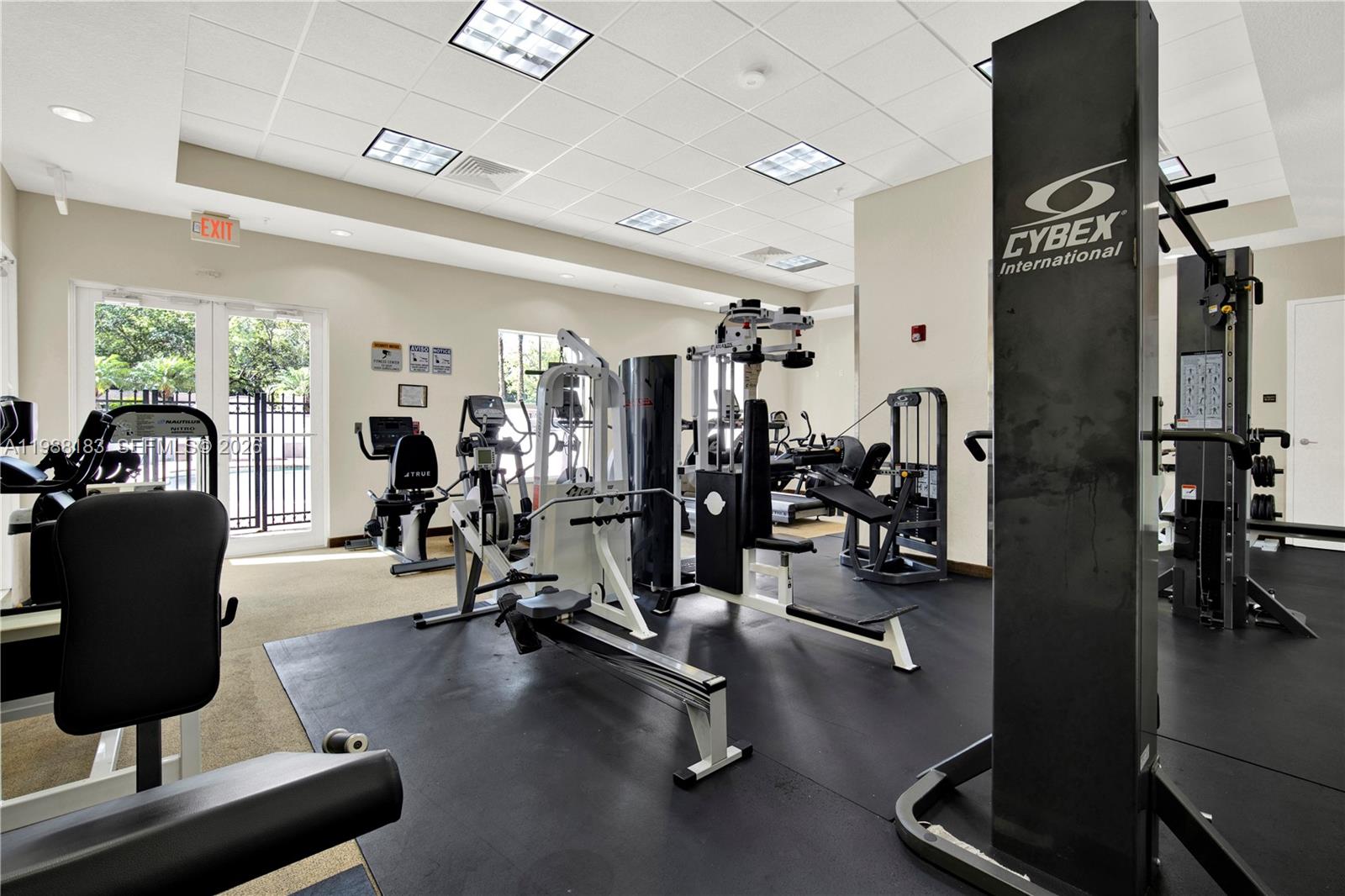 9021 Southwest 94th Street, Unit 308 Miami, FL 33176 - Photo 30 of 35 a view of a room with gym equipment