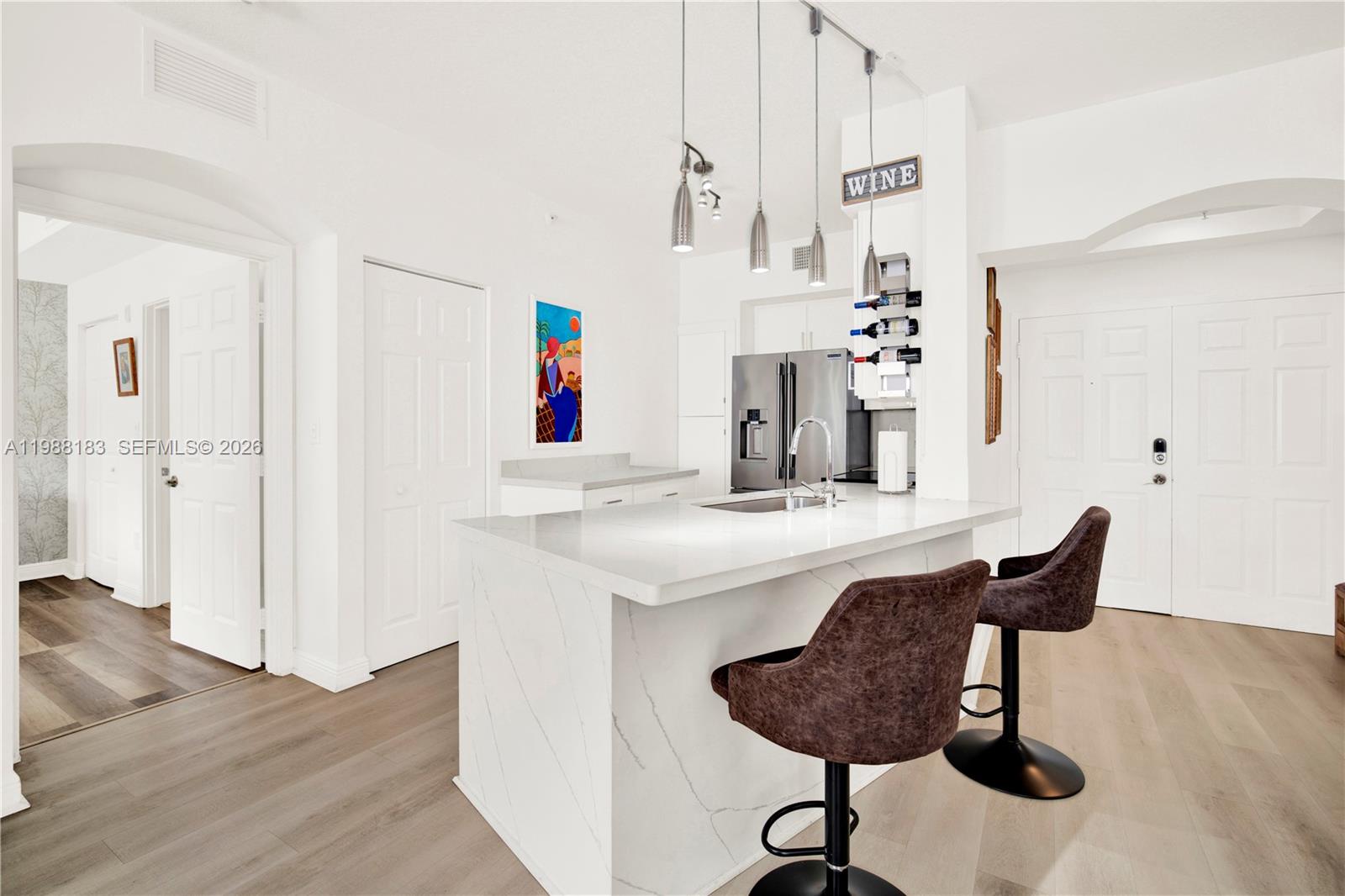 9021 Southwest 94th Street, Unit 308 Miami, FL 33176 - Photo 4 of 35 a room with table chairs and wooden floor