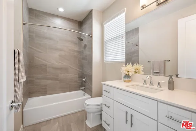 a bathroom with a sink a toilet and a bathtub