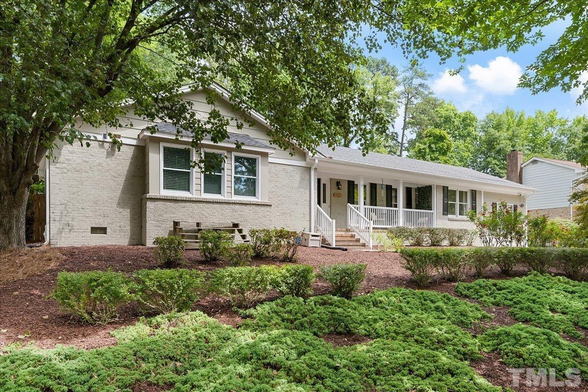 1313 Falls Church Road Raleigh, NC 27609 - Photo 2 of 40 a front view of a house with a yard