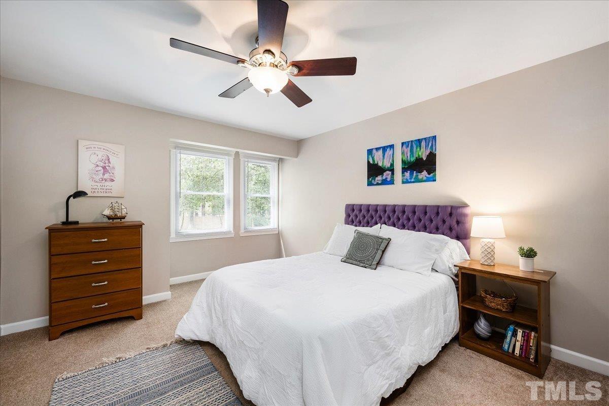 1313 Falls Church Road Raleigh, NC 27609 - Photo 28 of 40 a bedroom with a bed and a window