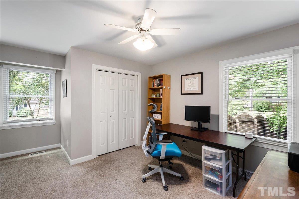1313 Falls Church Road Raleigh, NC 27609 - Photo 31 of 40 a view of a workspace with furniture and a window