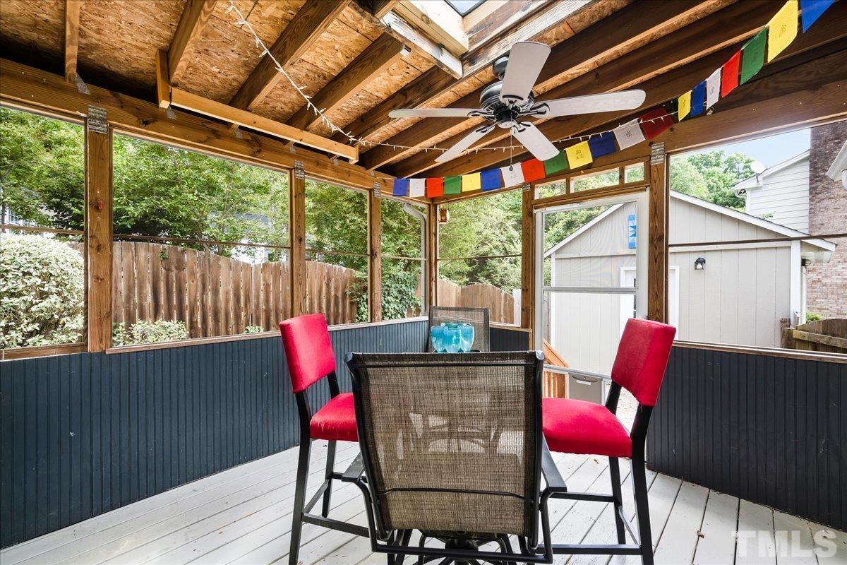 1313 Falls Church Road Raleigh, NC 27609 - Photo 33 of 40 a view of porch with a table and chairs