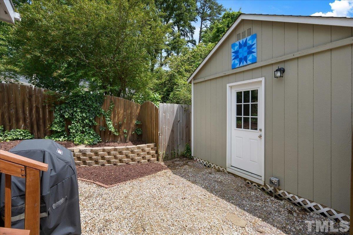1313 Falls Church Road Raleigh, NC 27609 - Photo 35 of 40 a house view with a backyard space