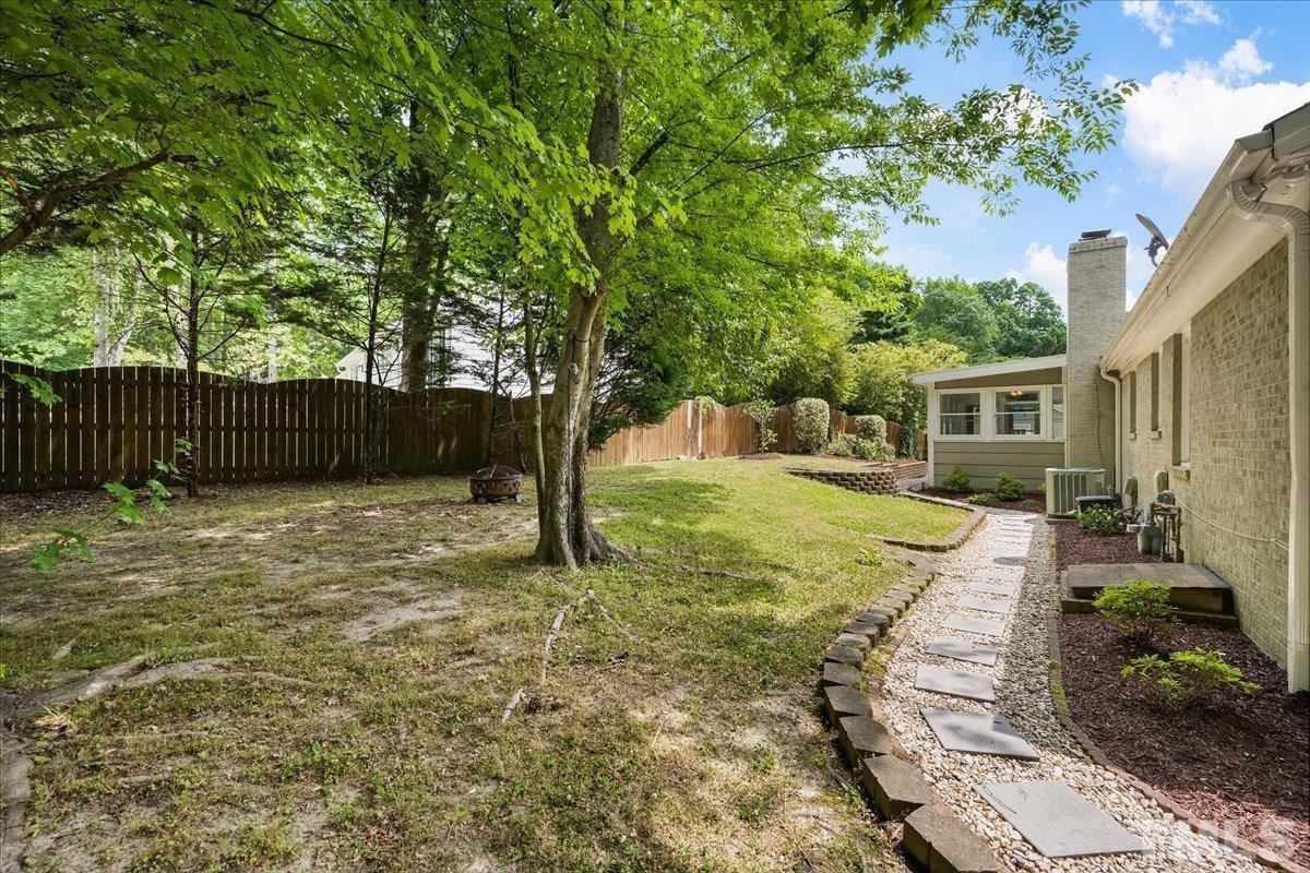 1313 Falls Church Road Raleigh, NC 27609 - Photo 39 of 40 a view of a backyard with a tree