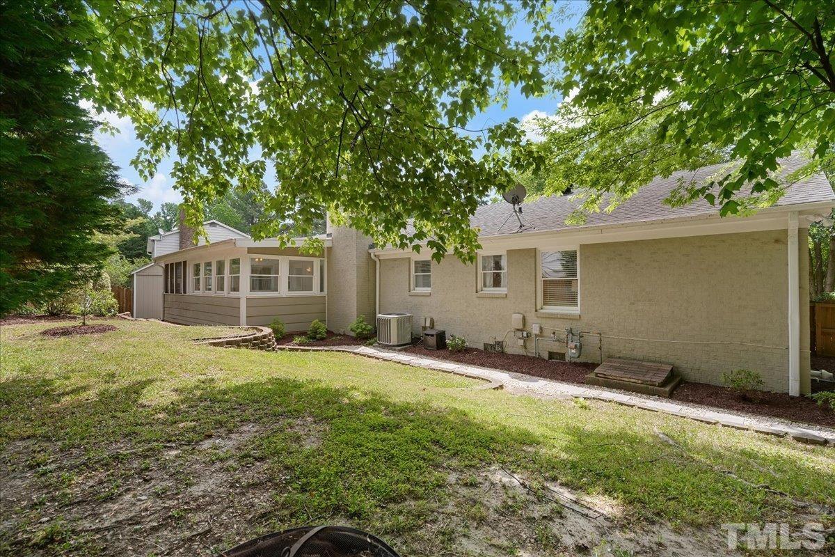 1313 Falls Church Road Raleigh, NC 27609 - Photo 40 of 40 a front view of a house with a garden