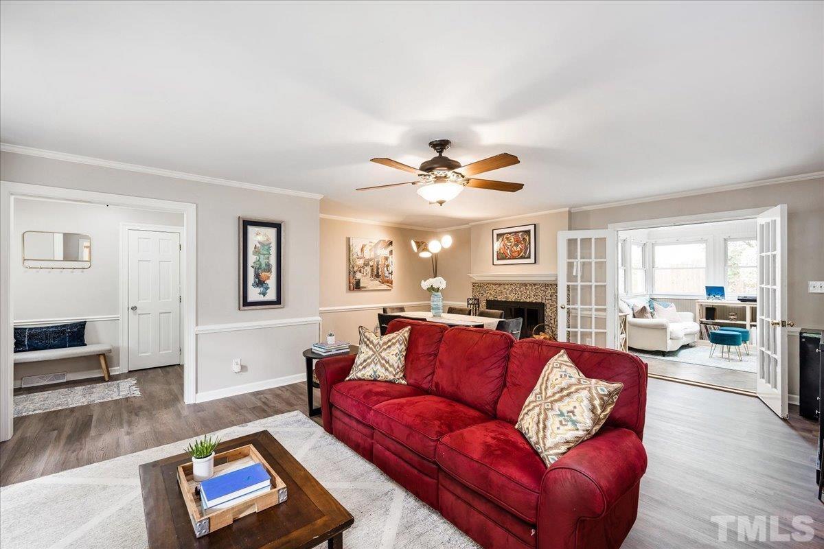 1313 Falls Church Road Raleigh, NC 27609 - Photo 9 of 40 a living room with furniture and a large window