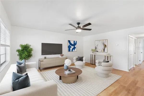 a living room with furniture and a flat screen tv