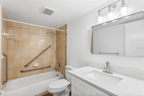 a bathroom with a sink a toilet and a bathtub
