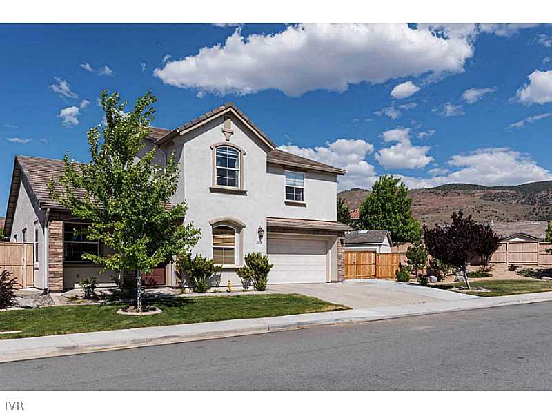 2525 Country Falls Lane Reno, NV 89521 - Photo 1 of 34 a front view of a house with a yard
