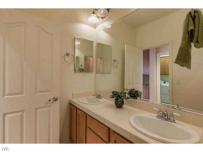 2525 Country Falls Lane Reno, NV 89521 - Photo 22 of 34 a bathroom with a sink and a mirror