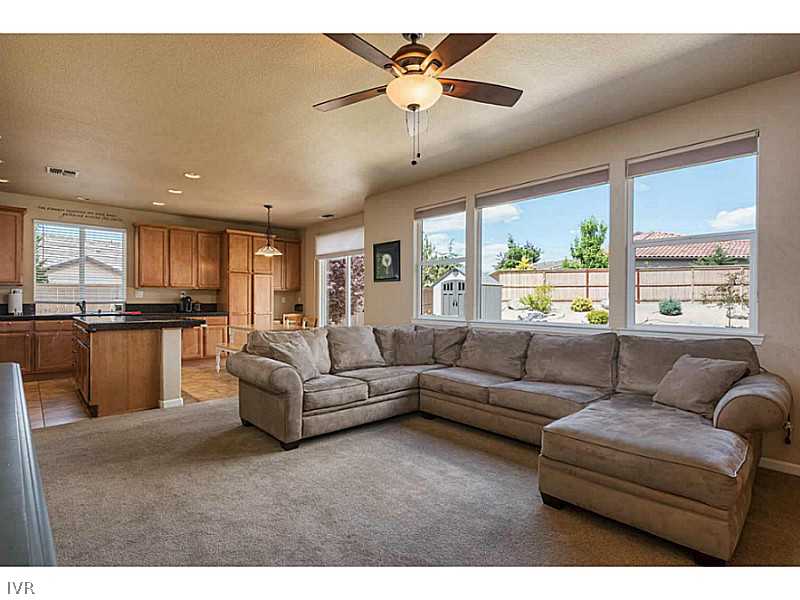 2525 Country Falls Lane Reno, NV 89521 - Photo 6 of 34 a living room with furniture and a large window