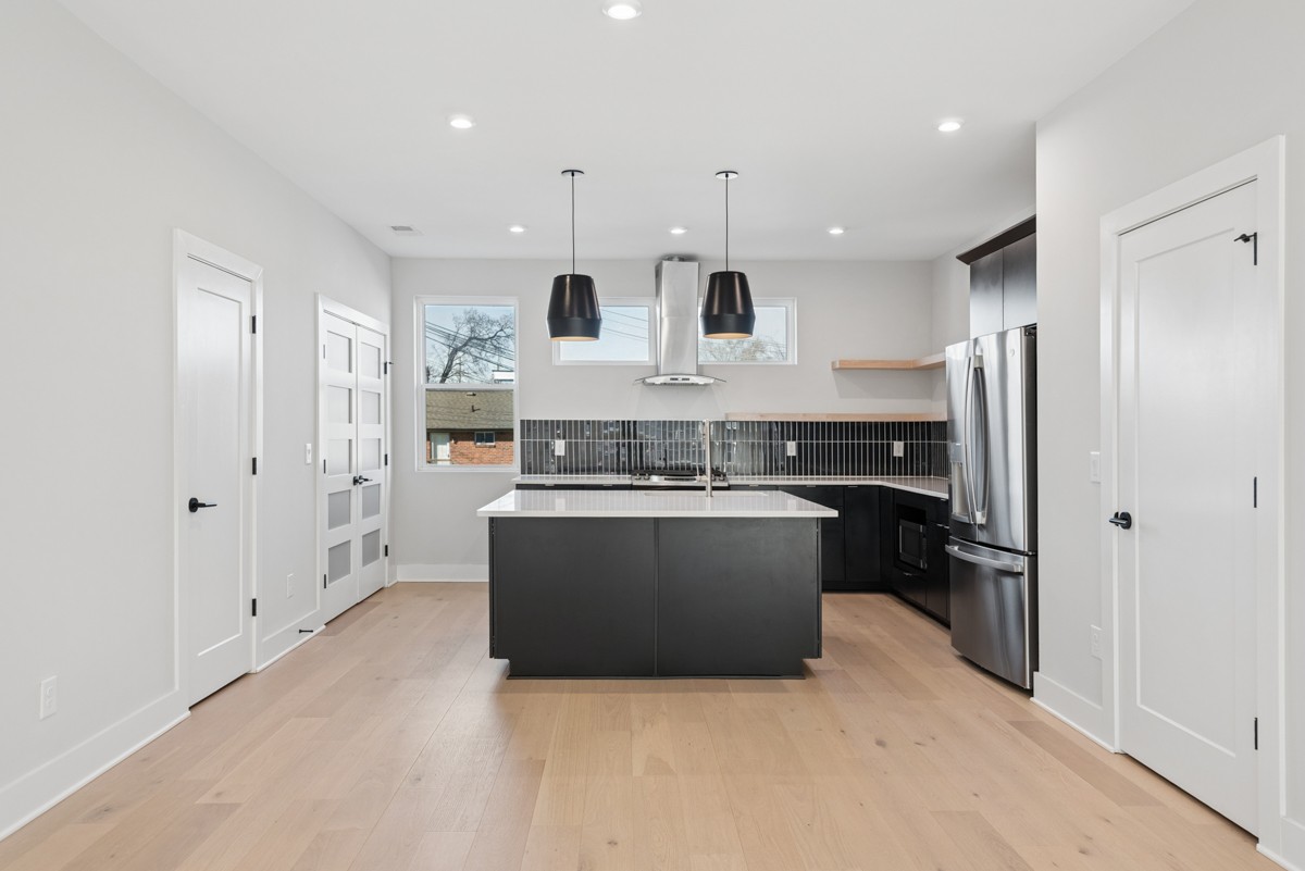4 D Trimble Street Nashville, TN 37210 - Photo 11 of 53 a large kitchen with stainless steel appliances granite countertop a stove and a refrigerator