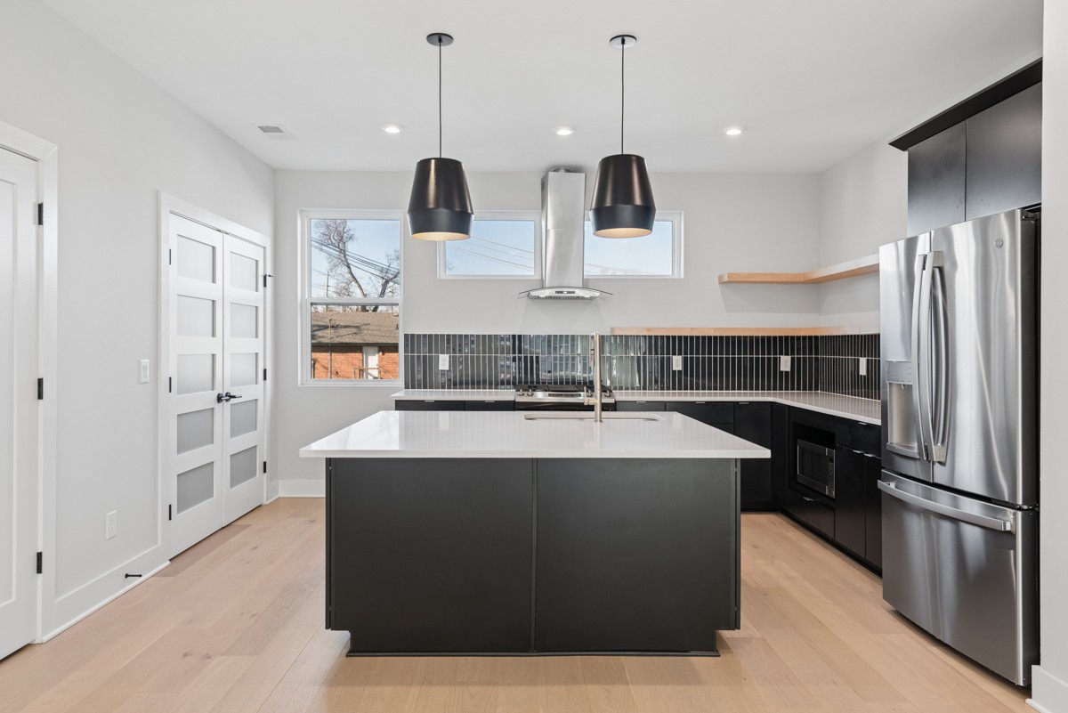 4 D Trimble Street Nashville, TN 37210 - Photo 12 of 53 a large kitchen with stainless steel appliances granite countertop a sink a stove and a refrigerator
