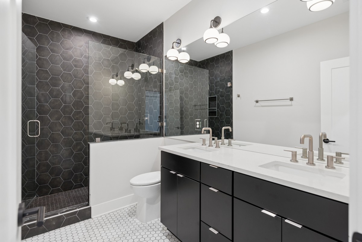 4 D Trimble Street Nashville, TN 37210 - Photo 25 of 53 a bathroom with a double vanity sink mirror and shower