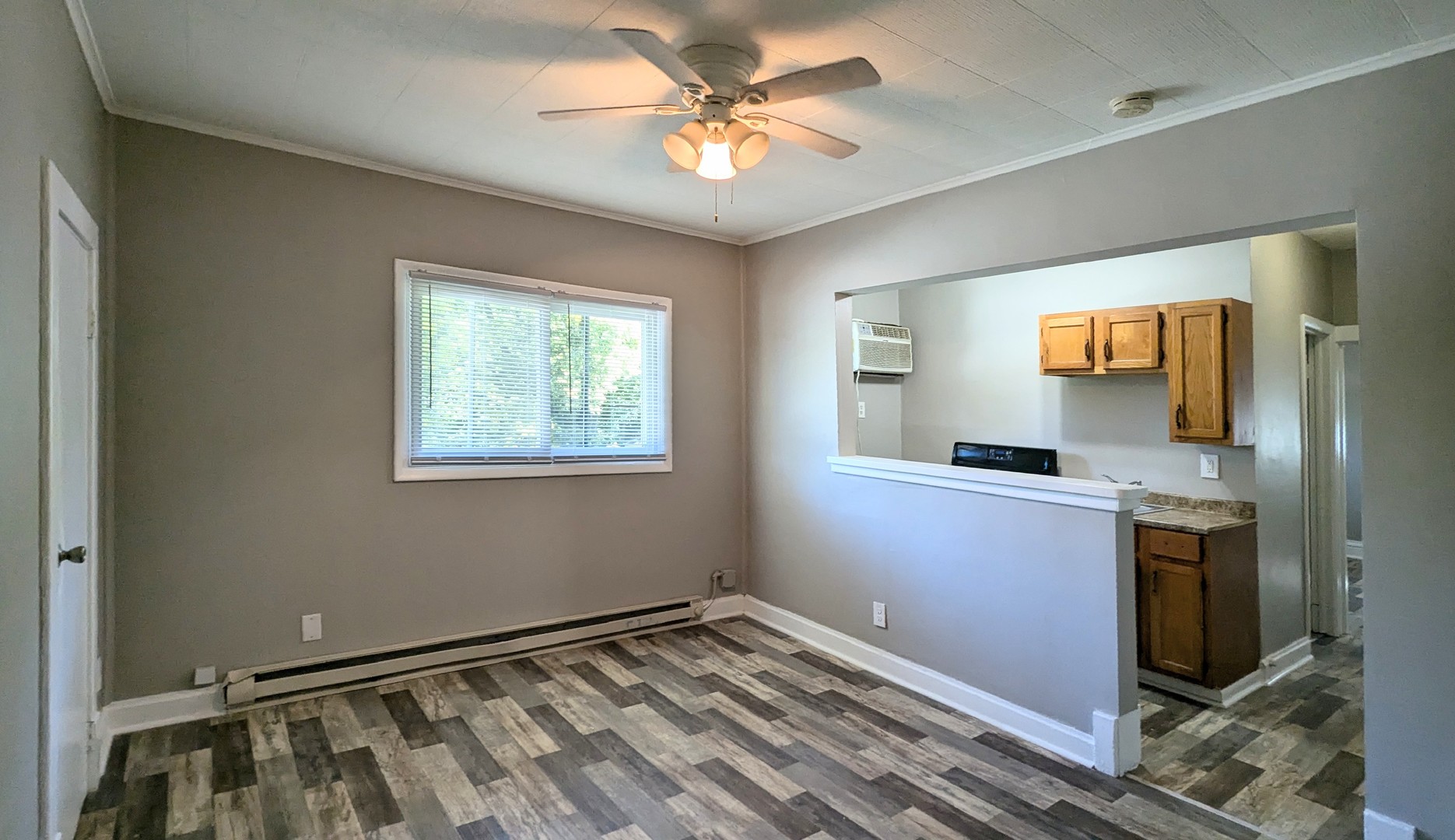832 Richards Street, Unit 2E Joliet, IL 60433 - Photo 3 of 5 a view of a room with window and a ceiling fan