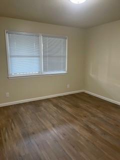 933 Rollins Road, Unit 4 Burlingame, CA 94010 - Photo 4 of 9 a view of an empty room with wooden floor and a window