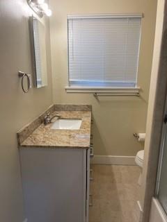 933 Rollins Road, Unit 4 Burlingame, CA 94010 - Photo 6 of 9 a bathroom with a granite countertop sink and a mirror