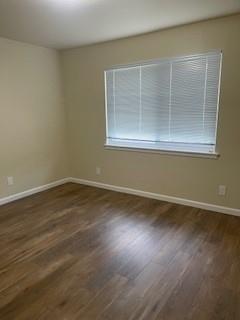 933 Rollins Road, Unit 4 Burlingame, CA 94010 - Photo 7 of 9 a view of empty room with wooden floor and fan