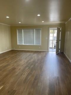 933 Rollins Road, Unit 4 Burlingame, CA 94010 - Photo 8 of 9 a view of an empty room with wooden floor and a window