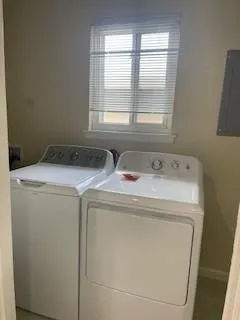 a utility room with dryer and washer