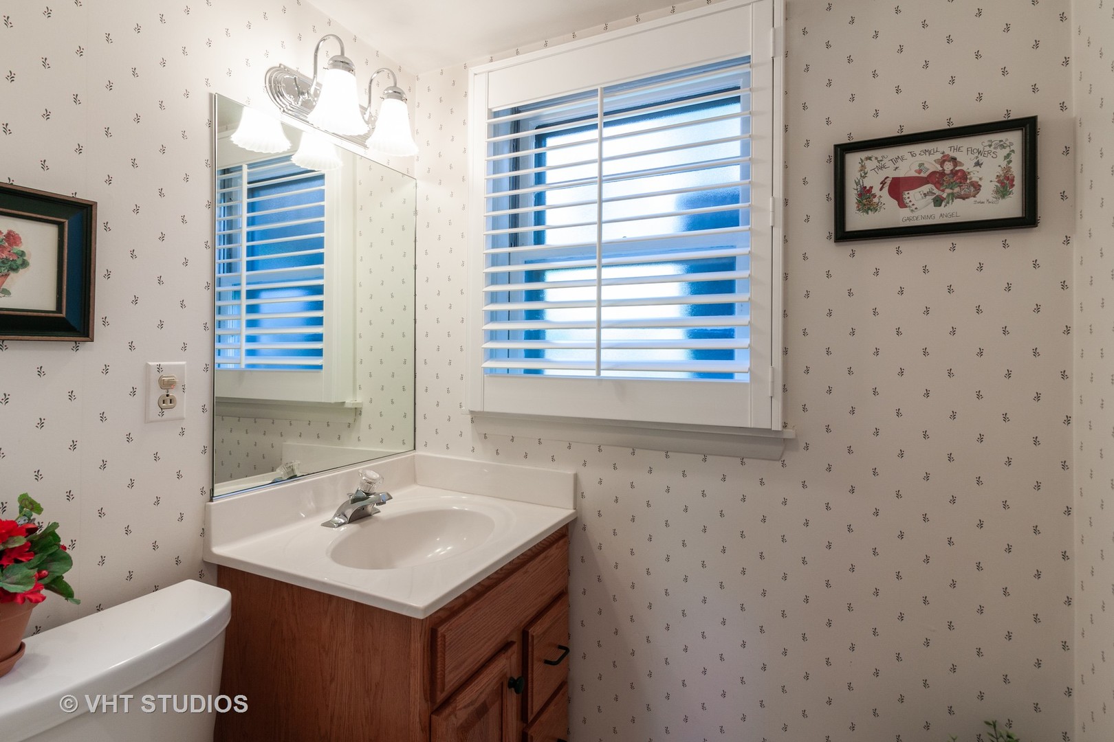 N255 Peter Road Winfield, IL 60190 - Photo 14 of 29 a bathroom with a sink a toilet and a large mirror