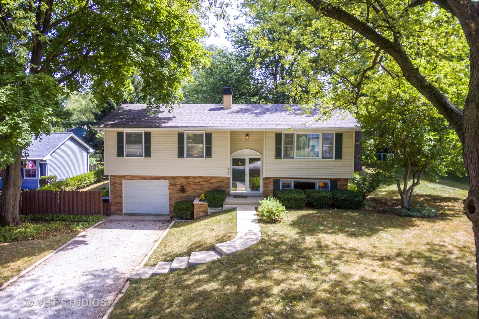 N255 Peter Road Winfield, IL 60190 - Photo 20 of 29 a front view of a house with a yard