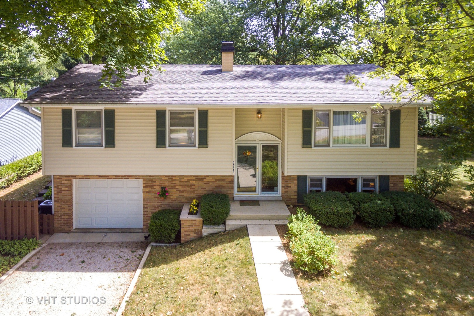 N255 Peter Road Winfield, IL 60190 - Photo 21 of 29 a front view of a house with garden