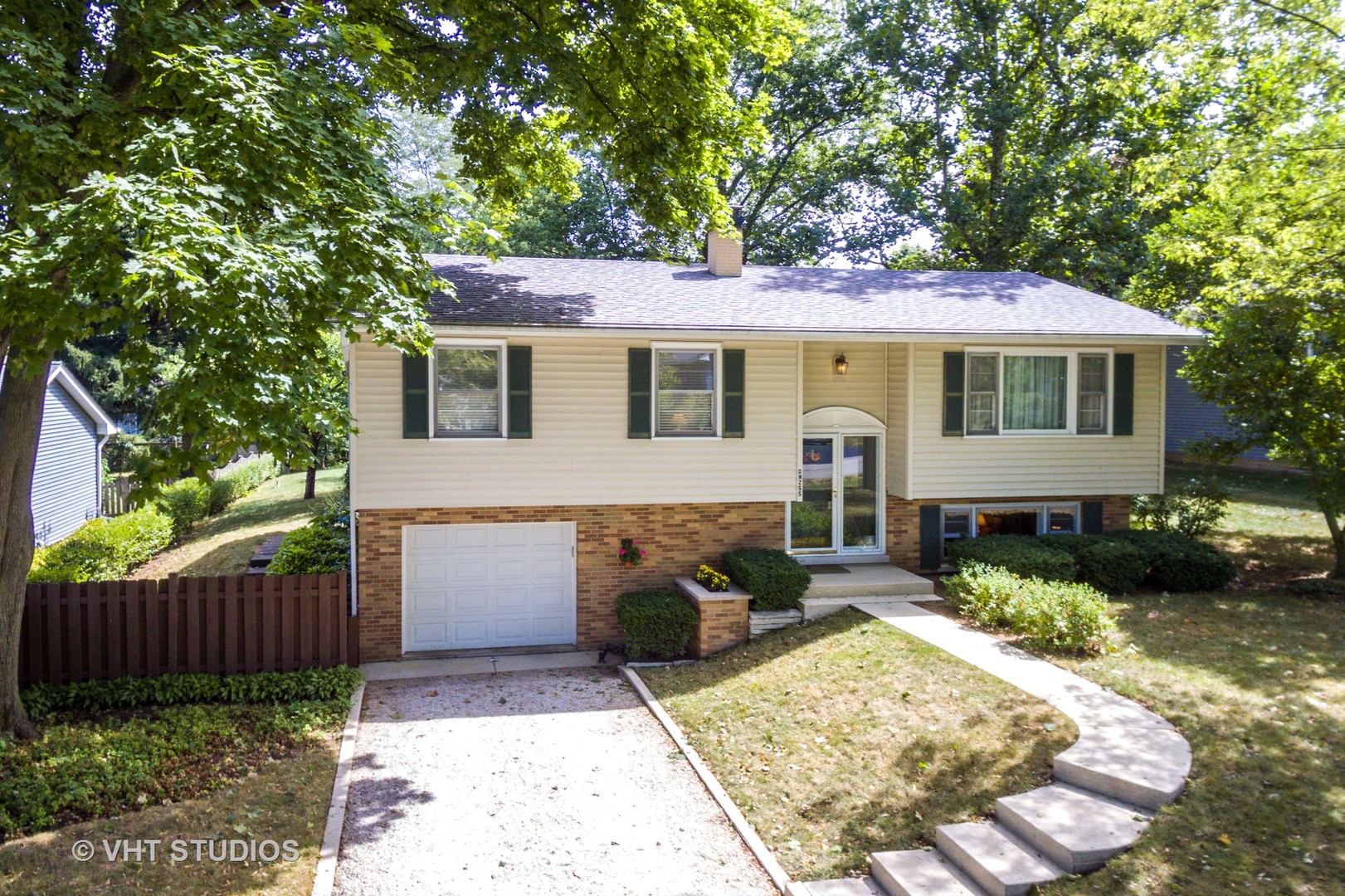 N255 Peter Road Winfield, IL 60190 - Photo 22 of 29 a front view of a house with garden